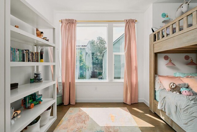 3001 Del Curto Rd Unit 14, Austin, TX 78704 - bedroom with wood finished floors and baseboards