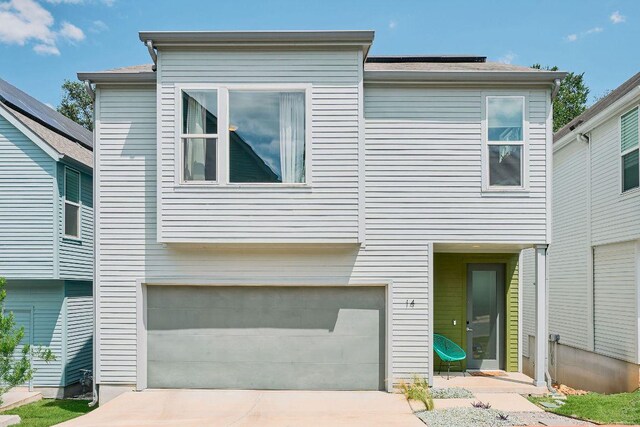 3001 Del Curto Rd Unit 14, Austin, TX 78704 - view of front facade with an attached garage and driveway