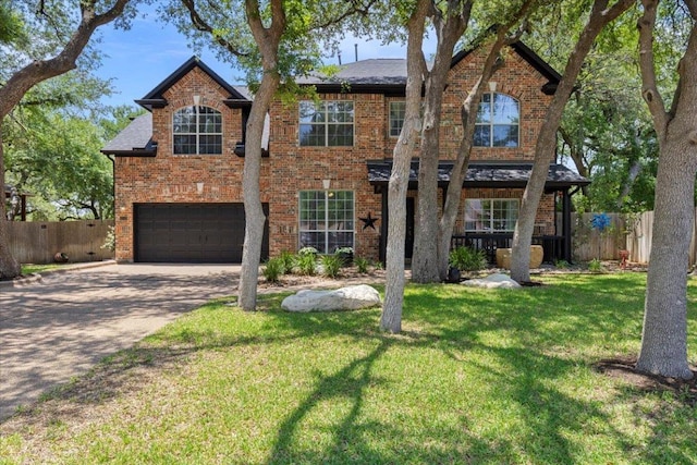 2713 Vaquera Ct, Round Rock, TX 78681 - traditional-style house with a garage, brick siding, and driveway