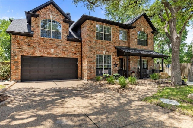 2713 Vaquera Ct, Round Rock, TX 78681 - traditional-style home with driveway, brick siding, a garage, and a porch