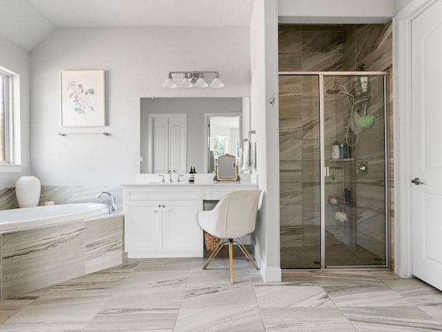 116 Waterloo Cv, Georgetown, TX 78628 - bathroom with vanity, a bath, a shower stall, and vaulted ceiling