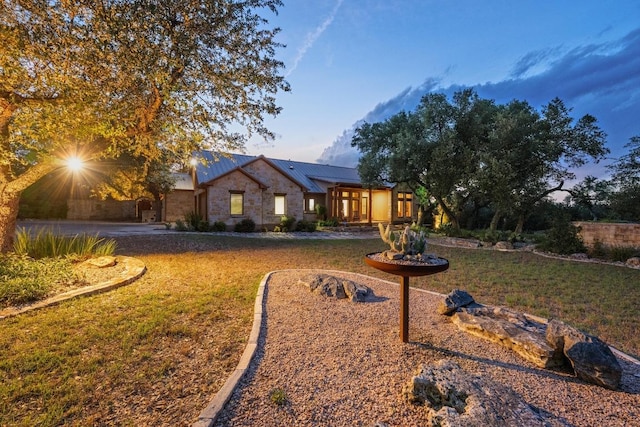 116 Horseshoe Dr, Dripping Springs, TX 78620 - view of front of property with a front lawn and metal roof