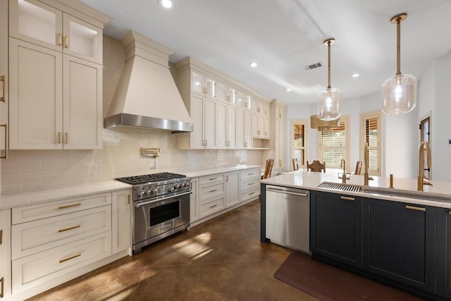 116 Horseshoe Dr, Dripping Springs, TX 78620 - kitchen featuring stainless steel appliances, wall chimney range hood, finished concrete floors, tasteful backsplash, and recessed lighting