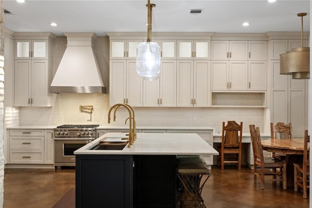 116 Horseshoe Dr, Dripping Springs, TX 78620 - kitchen with premium range hood, high end stove, decorative backsplash, a sink, and recessed lighting