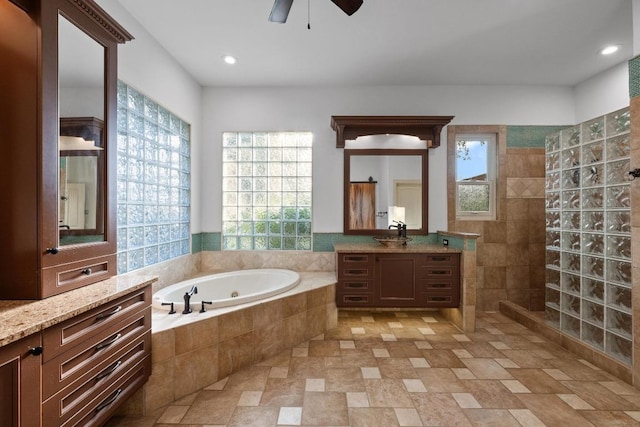 116 Horseshoe Dr, Dripping Springs, TX 78620 - full bath with a whirlpool tub, vanity, a ceiling fan, a walk in shower, and recessed lighting