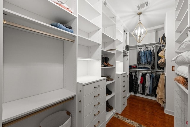 116 Horseshoe Dr, Dripping Springs, TX 78620 - walk in closet with dark wood finished floors and a chandelier
