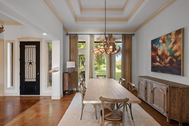 116 Horseshoe Dr, Dripping Springs, TX 78620 - dining area featuring a chandelier, a tray ceiling, and ornamental molding