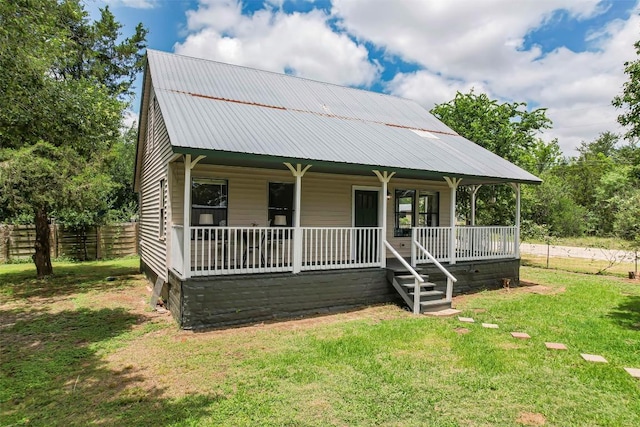 125 San Jacinto St, Bastrop, TX 78602 - view of front of house featuring covered porch and metal roof