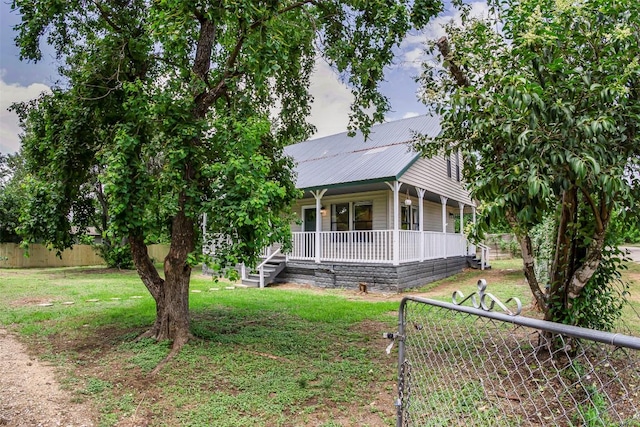 125 San Jacinto St, Bastrop, TX 78602 - farmhouse with covered porch and metal roof