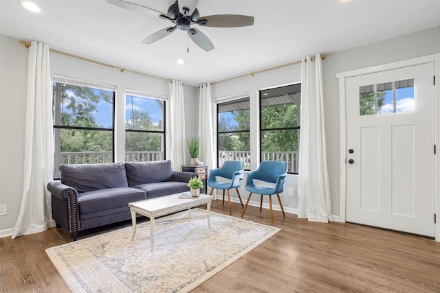 125 San Jacinto St, Bastrop, TX 78602 - living room featuring plenty of natural light, a ceiling fan, recessed lighting, light wood-style flooring, and baseboards