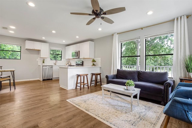 125 San Jacinto St, Bastrop, TX 78602 - living room with a ceiling fan, recessed lighting, baseboards, and light wood finished floors