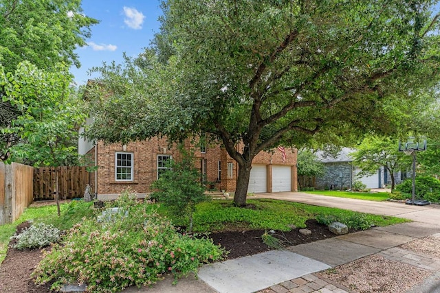1202 Tremont Dr, Cedar Park, TX 78613 - obstructed view of property featuring concrete driveway and brick siding
