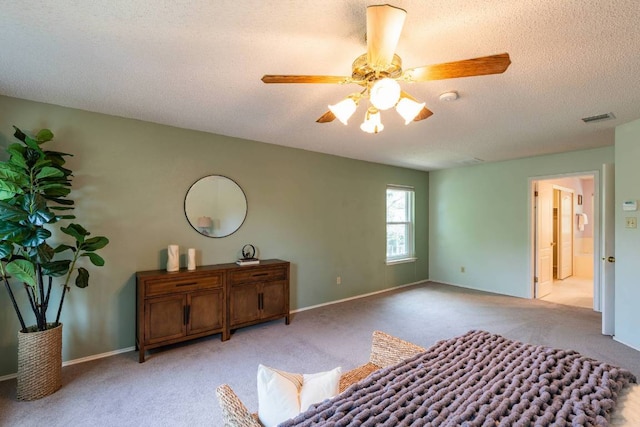 1202 Tremont Dr, Cedar Park, TX 78613 - bedroom featuring light colored carpet, a textured ceiling, a ceiling fan, and baseboards