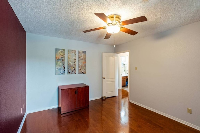 1202 Tremont Dr, Cedar Park, TX 78613 - spare room with wood finished floors, a ceiling fan, baseboards, and a textured ceiling