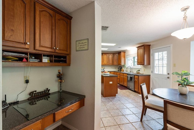 1202 Tremont Dr, Cedar Park, TX 78613 - kitchen featuring dishwasher, a textured ceiling, brown cabinetry, decorative light fixtures, and a sink