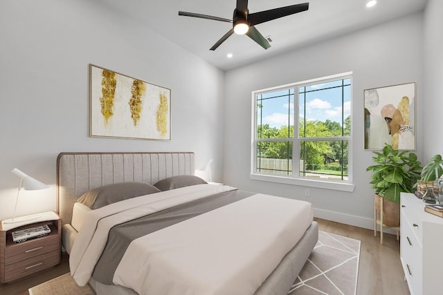 14804 Arrowhead Dr, Leander, TX 78641 - bedroom with light wood-type flooring, recessed lighting, and a ceiling fan