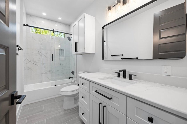 14804 Arrowhead Dr, Leander, TX 78641 - full bathroom featuring vanity, bath / shower combo with glass door, and recessed lighting
