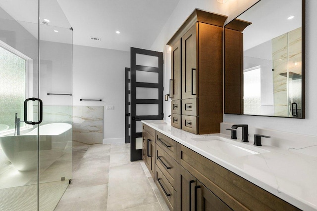14804 Arrowhead Dr, Leander, TX 78641 - full bathroom featuring double vanity, a stall shower, and recessed lighting