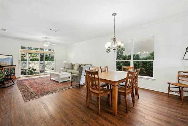 308 Hills Of Texas Trl, Georgetown, TX 78633 - dining room featuring dark wood finished floors, a ceiling fan, a chandelier, and baseboards
