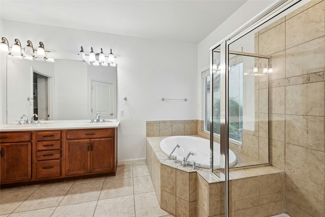 308 Hills Of Texas Trl, Georgetown, TX 78633 - bathroom with a garden tub, double vanity, a shower stall, and tile patterned floors