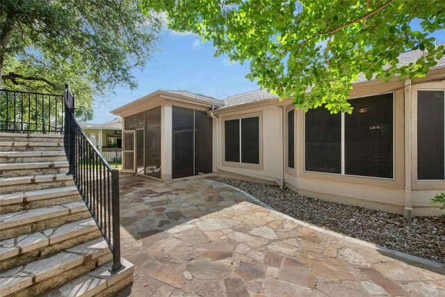 308 Hills Of Texas Trl, Georgetown, TX 78633 - back of house with stairs, a sunroom, and a patio