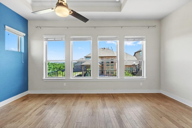 18716 Waltz Ct, Austin, TX 78738 - unfurnished room with wood finished floors, healthy amount of natural light, a ceiling fan, baseboards, and ornamental molding