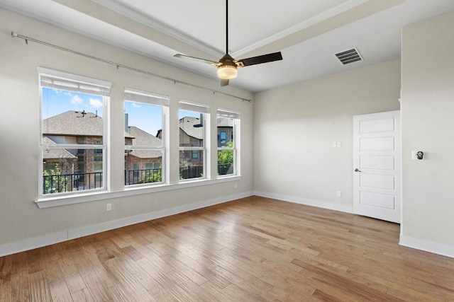 18716 Waltz Ct, Austin, TX 78738 - empty room featuring healthy amount of natural light, a ceiling fan, wood finished floors, baseboards, and crown molding