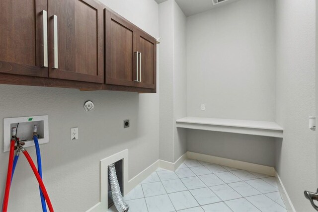 18716 Waltz Ct, Austin, TX 78738 - laundry room featuring cabinet space, electric dryer hookup, washer hookup, baseboards, and gas dryer hookup