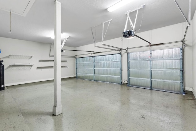 18716 Waltz Ct, Austin, TX 78738 - garage featuring a garage door opener and baseboards