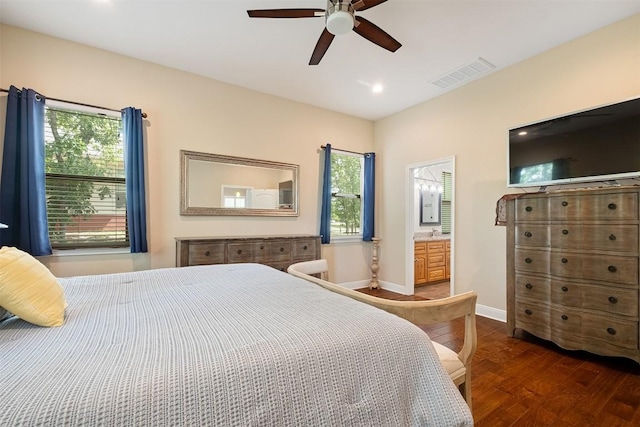 108 Kaliu Ct, Bastrop, TX 78602 - bedroom with wood finished floors, recessed lighting, a ceiling fan, and ensuite bathroom