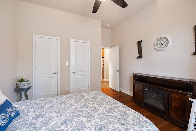 108 Kaliu Ct, Bastrop, TX 78602 - bedroom with dark wood finished floors and a ceiling fan