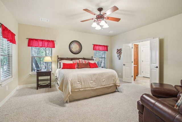 600 Augusta Cir N, Point Venture, TX 78645 - carpeted bedroom with baseboards and ceiling fan