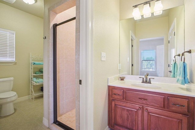 600 Augusta Cir N, Point Venture, TX 78645 - full bath with toilet, vanity, a shower stall, and tile patterned flooring