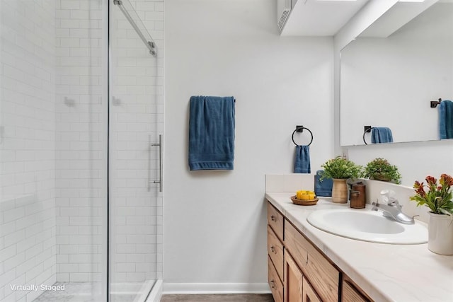 283 Rockdale W Rd, Rockdale, TX 76567 - bathroom featuring a shower stall, vanity, and baseboards