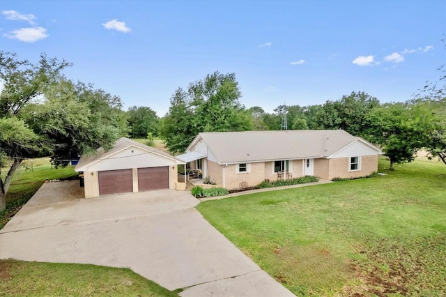 283 Rockdale W Rd, Rockdale, TX 76567 - single story home featuring a front yard, driveway, and an attached garage