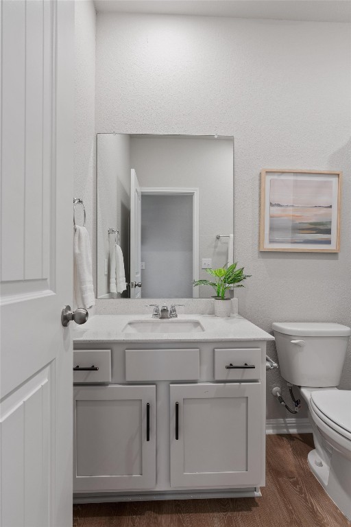 632 Otto Ave, Georgetown, TX 78626 - half bath featuring vanity and wood finished floors