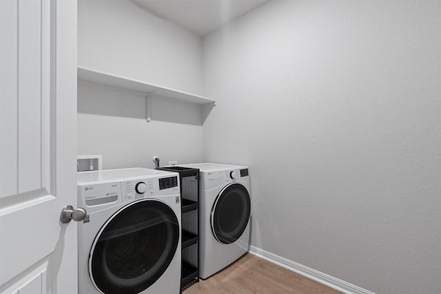 632 Otto Ave, Georgetown, TX 78626 - laundry area with independent washer and dryer and light wood finished floors