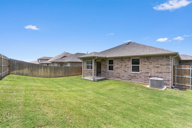 632 Otto Ave, Georgetown, TX 78626 - back of property with brick siding, a fenced backyard, and a shingled roof