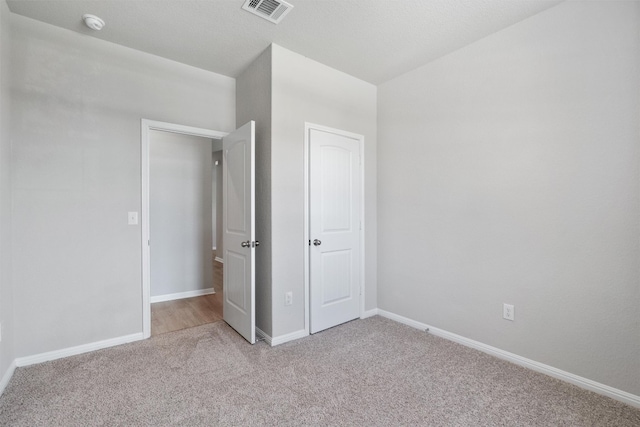 632 Otto Ave, Georgetown, TX 78626 - unfurnished bedroom with light colored carpet and baseboards