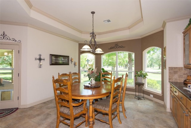1265 Mourning Dove Ct, Salado, TX 76571 - dining area featuring a raised ceiling, plenty of natural light, baseboards, and ornamental molding