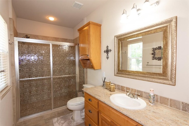 1265 Mourning Dove Ct, Salado, TX 76571 - bathroom featuring vanity, toilet, a shower stall, and tile patterned flooring