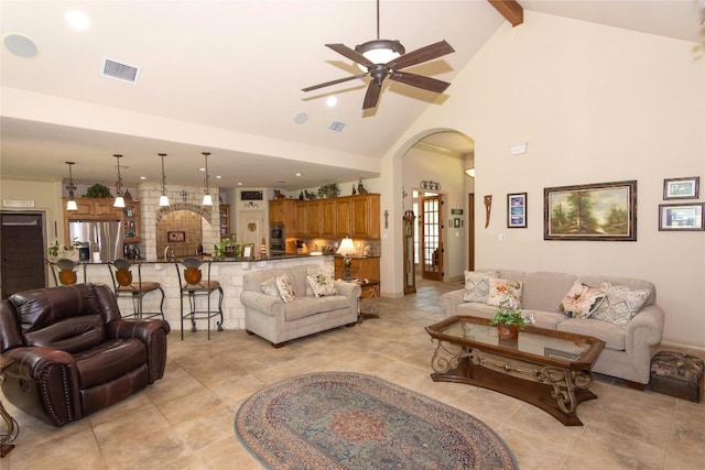 1265 Mourning Dove Ct, Salado, TX 76571 - living room featuring arched walkways, high vaulted ceiling, a ceiling fan, beamed ceiling, and recessed lighting