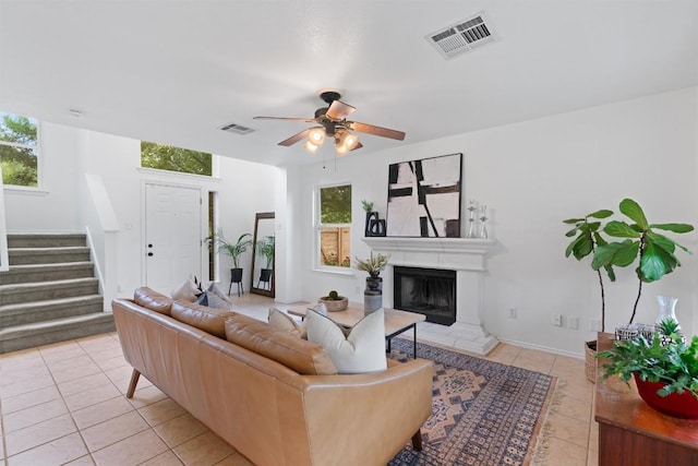 14708 Single Trce, Austin, TX 78728 - living room featuring light tile patterned floors, stairway, plenty of natural light, and a ceiling fan