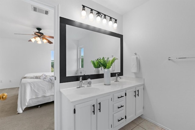 14708 Single Trce, Austin, TX 78728 - ensuite bathroom featuring double vanity, a ceiling fan, and baseboards