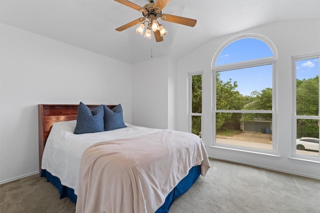 14708 Single Trce, Austin, TX 78728 - bedroom featuring carpet flooring, multiple windows, vaulted ceiling, and ceiling fan