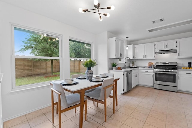 14708 Single Trce, Austin, TX 78728 - kitchen with stainless steel appliances, under cabinet range hood, a sink, and light countertops