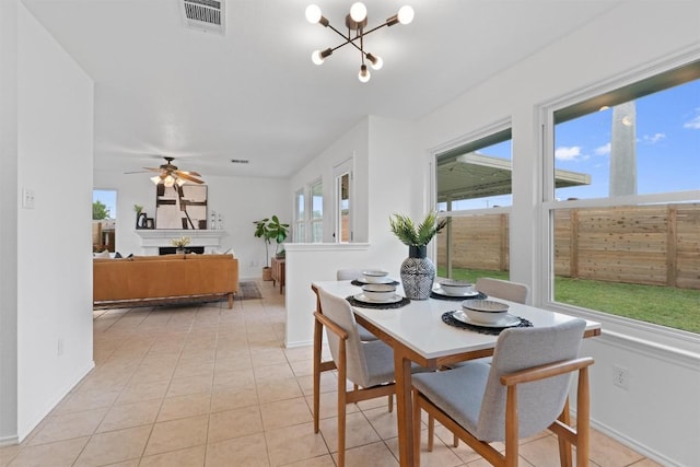 14708 Single Trce, Austin, TX 78728 - dining space featuring a chandelier, light tile patterned flooring, and baseboards