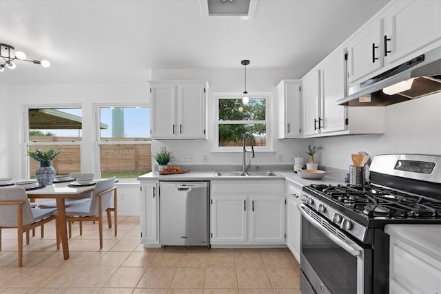 14708 Single Trce, Austin, TX 78728 - kitchen with appliances with stainless steel finishes, under cabinet range hood, a sink, light countertops, and white cabinetry