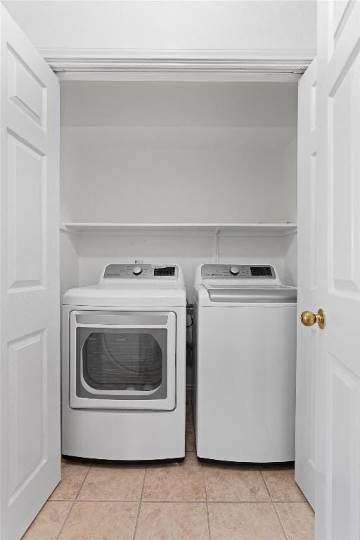 14708 Single Trce, Austin, TX 78728 - washroom featuring independent washer and dryer and light tile patterned floors