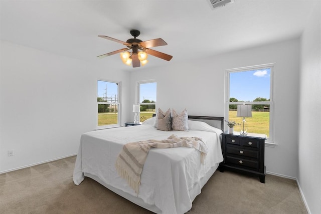 14708 Single Trce, Austin, TX 78728 - bedroom featuring light colored carpet, a ceiling fan, and baseboards